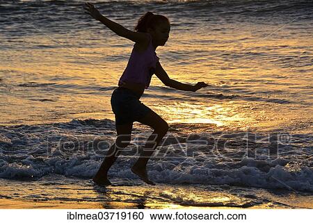 "Girl playing on the beach, silhouette at sunset, Jericoacoara, Ceara, Brazil, South America" View Large Photo Image Stock Image - "Girl playing on the beach, silhouette at sunset, Jericoacoara, Ceara, Brazil, South America". Fotosearch