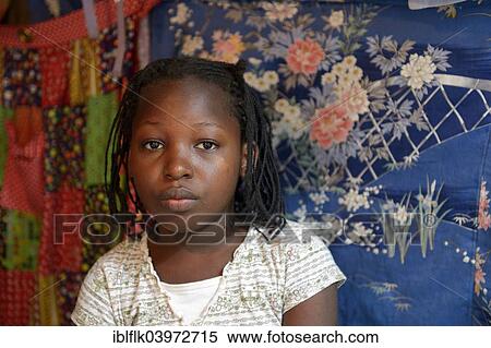 "Girl, portrait, in front of colorful cloths, Camp Icare for earthquake refugees, Fort National, Port-au-Prince, Haiti, North America" View Large Photo Image Stock Photography - "Girl, portrait, in front of colorful cloths, Camp Icare for earthquake refugees, Fort National, Port-au-Prince, Haiti, North America". Fotosearch