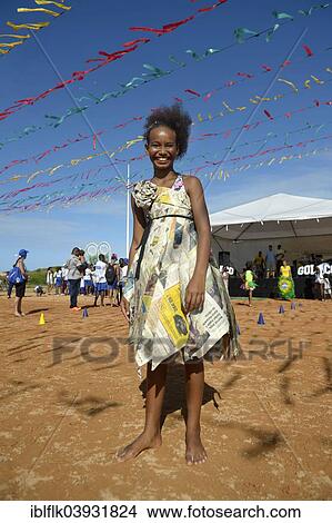 "Girl presenting a dress made of recycled newspapers at a fashion show of a social project, Salvador da Bahia, Bahia, Brazil, South America" View Large Photo Image Picture - "Girl presenting a dress made of recycled newspapers at a fashion show of a social project, Salvador da Bahia, Bahia, Brazil, South America". Fotosearch