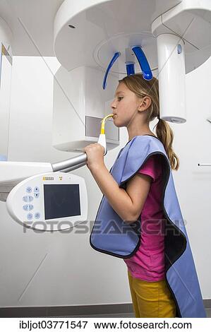 "Girl receiving an x-ray of her teeth, wearing a lead vest as radiation protection, Germany, Europe" View Large Photo Image Stock Photo - "Girl receiving an x-ray of her teeth, wearing a lead vest as radiation protection, Germany, Europe". Fotosearch