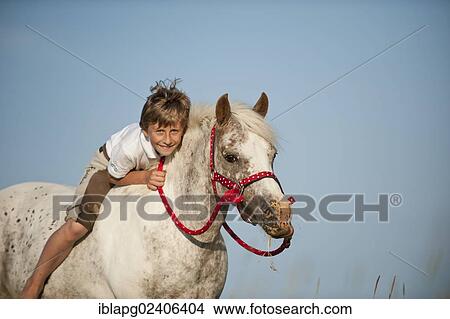 Girl riding a pony bareback View Large Photo Image Picture - Girl riding a pony bareback. Fotosearch