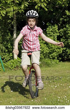 "Girl riding a unicycle, Germany, Europe" View Large Photo Image Stock Image - "Girl riding a unicycle, Germany, Europe". Fotosearch