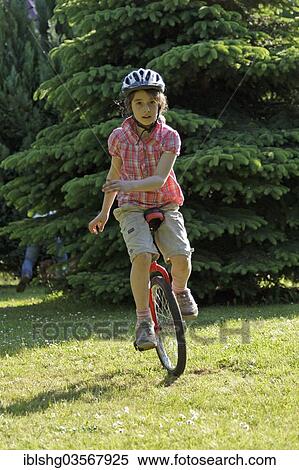 "Girl riding a unicycle, Germany, Europe" View Large Photo Image Stock Photography - "Girl riding a unicycle, Germany, Europe". Fotosearch