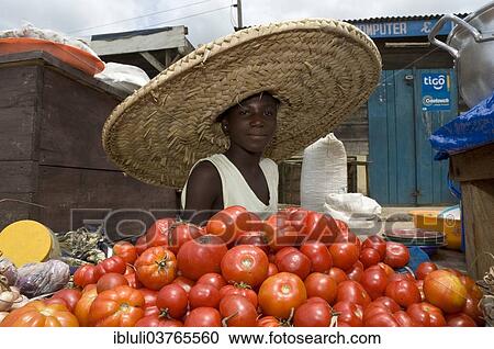 "Girl selling tomatoes on a market, Nsawam, Eastern Region, Ghana, Africa" View Large Photo Image Stock Image - "Girl selling tomatoes on a market, Nsawam, Eastern Region, Ghana, Africa". Fotosearch