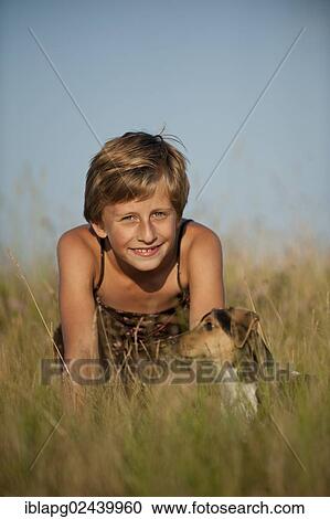Girl sitting with a Dansk-Svensk Gardshund or Danish Swedish Farmdog in a meadow View Large Photo Image Stock Image - Girl sitting with a Dansk-Svensk Gardshund or Danish Swedish Farmdog in a meadow. Fotosearch