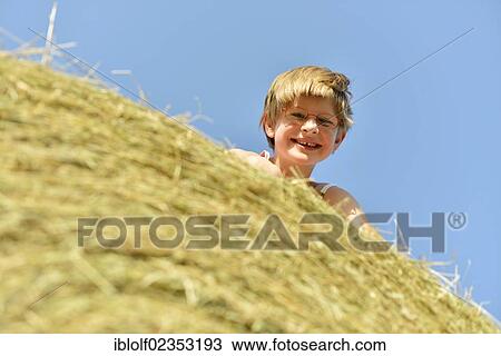 "Girl, six years, with glasses and gaps in teeth, on a straw bale, Germany, Europe" View Large Photo Image Stock Image - "Girl, six years, with glasses and gaps in teeth, on a straw bale, Germany, Europe". Fotosearch