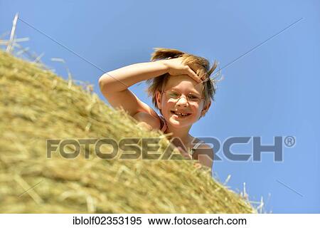"Girl, six years, with glasses and gaps in teeth, on a straw bale, Germany, Europe" View Large Photo Image Stock Photography - "Girl, six years, with glasses and gaps in teeth, on a straw bale, Germany, Europe". Fotosearch