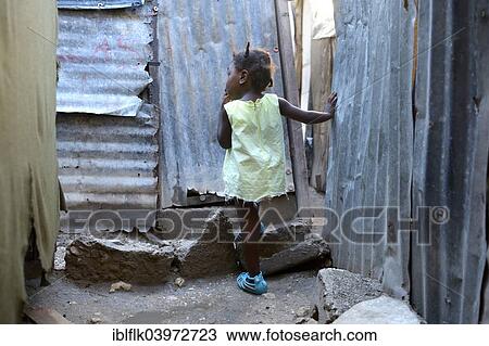 "Girl, two years, standing in the doorway of a shack, Camp Icare for earthquake refugees, Fort National, Port-au-Prince, Haiti, North America" View Large Photo Image Stock Image - "Girl, two years, standing in the doorway of a shack, Camp Icare for earthquake refugees, Fort National, Port-au-Prince, Haiti, North America". Fotosearch