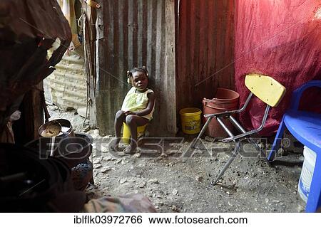 "Girl, two years, using a plastic bucket as a toilet, Camp Icare, camp for earthquake refugees, Fort National, Port-au-Prince, Haiti, North America" View Large Photo Image Stock Photograph - "Girl, two years, using a plastic bucket as a toilet, Camp Icare, camp for earthquake refugees, Fort National, Port-au-Prince, Haiti, North America". Fotosearch