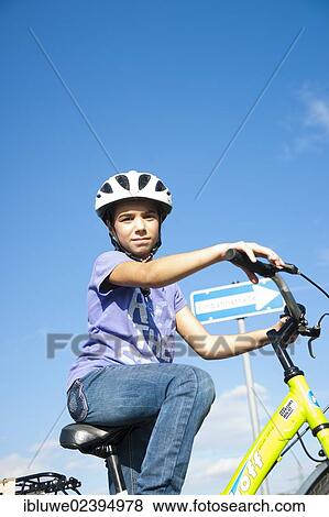 Girl wearing a bike helmet at a traffic awareness course View Large Photo Image Stock Photo - Girl wearing a bike helmet at a traffic awareness course. Fotosearch
