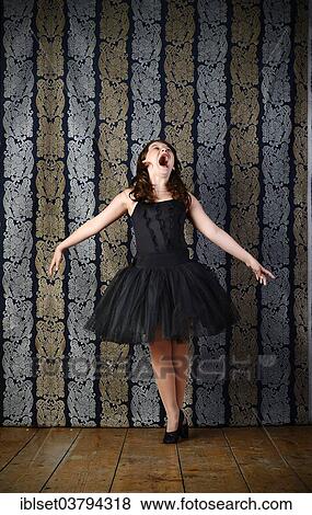 Girl wearing a black ballet dress screaming View Large Photo Image Stock Photo - Girl wearing a black ballet dress screaming. Fotosearch