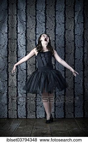 Girl wearing a black ballet dress screaming View Large Photo Image Stock Photo - Girl wearing a black ballet dress screaming. Fotosearch