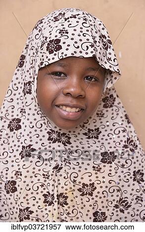 "Girl wearing a headscarf, Stone Town, Zanzibar City, Zanzibar, Tanzania, Africa" View Large Photo Image Stock Photo - "Girl wearing a headscarf, Stone Town, Zanzibar City, Zanzibar, Tanzania, Africa". Fotosearch