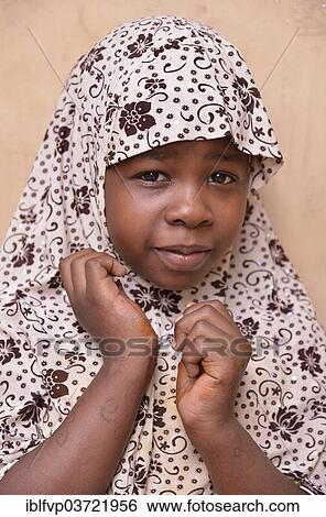 Stock Photograph - "Girl wearing a headscarf, Stone Town, Zanzibar City, Zanzibar, Tanzania, Africa". Fotosearch