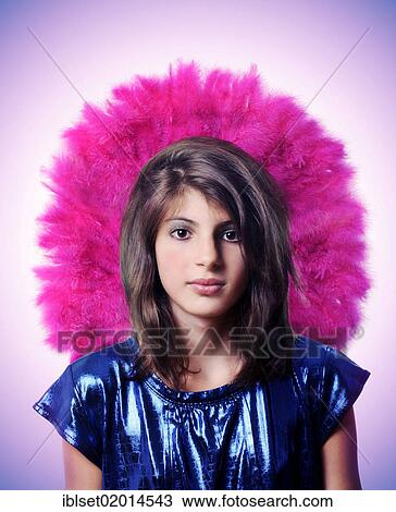 Stock Image - "Girl wearing a pink head-dress, portrait". Fotosearch