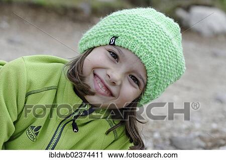 Stock Image - "Girl wearing a wool cap, portrait". Fotosearch