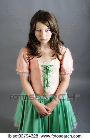 Stock Photo - Girl wearing an old-fashioned dress looking sad. Fotosearch