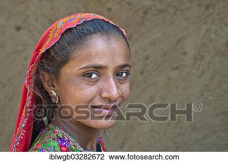 Stock Image - "Girl with a headscarf and jewellery, portrait, Rann of Kutch, Gujarat, India, Asia". Fotosearch