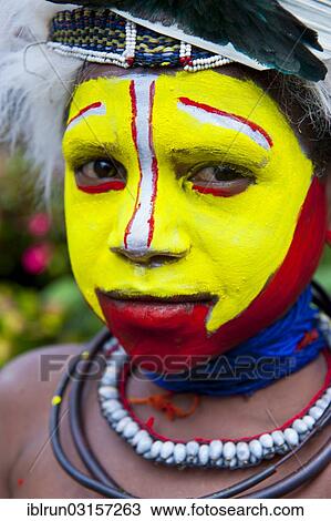 "Girl with colourful decorations and face paint is celebrating at the traditional Sing Sing gathering in the highlands, Paya, Papua New Guinea, Oceania" View Large Photo Image Stock Image - "Girl with colourful decorations and face paint is celebrating at the traditional Sing Sing gathering in the highlands, Paya, Papua New Guinea, Oceania". Fotosearch
