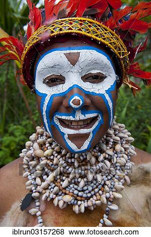 "Girl with colourful decorations and face paint is celebrating at the traditional Sing Sing gathering in the highlands, Paya, Papua New Guinea, Oceania" View Large Photo Image Stock Photo - "Girl with colourful decorations and face paint is celebrating at the traditional Sing Sing gathering in the highlands, Paya, Papua New Guinea, Oceania". Fotosearch