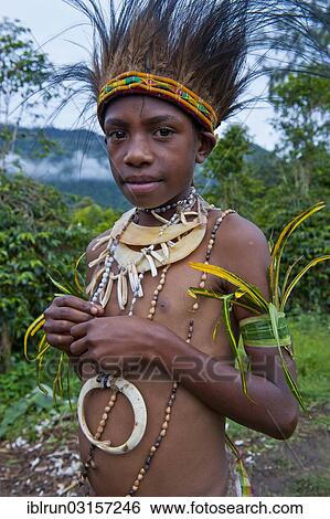 "Girl with colourful decorations is celebrating at the traditional Sing Sing gathering in the Highlands, Paya, Papua New Guinea, Oceania" View Large Photo Image Stock Photograph - "Girl with colourful decorations is celebrating at the traditional Sing Sing gathering in the Highlands, Paya, Papua New Guinea, Oceania". Fotosearch