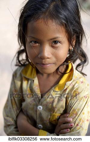 "Girl with her arms crossed, Trapang Village, Bathi District, Takeo Province, Cambodia, Asia" View Large Photo Image Stock Photograph - "Girl with her arms crossed, Trapang Village, Bathi District, Takeo Province, Cambodia, Asia". Fotosearch