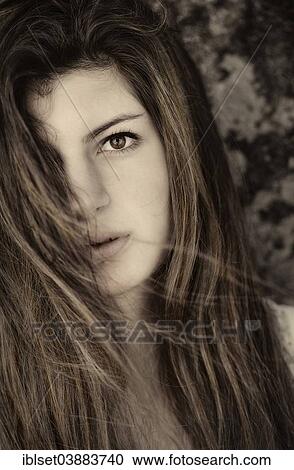 Stock Image - "Girl with long hair, 15 years, portrait". Fotosearch