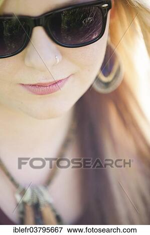 Stock Photo - "Girl with sunglasses, Austria, Europe". Fotosearch