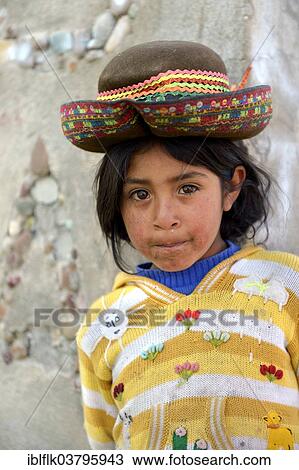 Stock Image - "Girl with traditional hat, Union Potrero, Quispillacta, Ayacucho, Peru, South America". Fotosearch