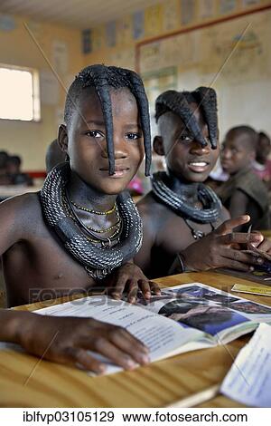 "Girls, Himba pupils, sitting in a classroom at the Omohanga Primary School, Himba school, Omohanga, Kaokoland, Kunene, Namibia, Africa" View Large Photo Image Stock Photo - "Girls, Himba pupils, sitting in a classroom at the Omohanga Primary School, Himba school, Omohanga, Kaokoland, Kunene, Namibia, Africa". Fotosearch