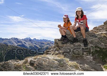 Stock Image - "Girls on a mountain tour, Pas du Chai, Queyras valley, Alps, Pas du Chai Provence-Alpes-Cote d'Azur, Queyras Sudalpen, Hautes-Alpes, France, Europe". Fotosearch