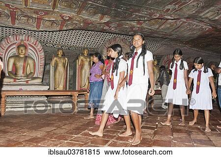 "Girls, school children visiting the temple, Buddha statues, colourful murals, frescoes, Maharaja-Iena cave, Buddhist cave temple of Dambulla, Golden Temple of Dambulla, Central Province, Sri Lanka, Asia" View Large Photo Image Stock Photography - "Girls, school children visiting the temple, Buddha statues, colourful murals, frescoes, Maharaja-Iena cave, Buddhist cave temple of Dambulla, Golden Temple of Dambulla, Central Province, Sri Lanka, Asia". Fotosearch