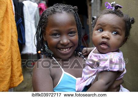 "Girls, sisters, 9 years and 1 year, portrait, Camp Icare for earthquake refugees, Fort National, Port-au-Prince, Haiti, North America" View Large Photo Image Stock Photo - "Girls, sisters, 9 years and 1 year, portrait, Camp Icare for earthquake refugees, Fort National, Port-au-Prince, Haiti, North America". Fotosearch