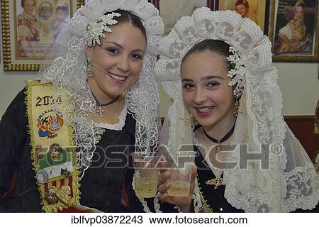 "Girls wearing traditional dress at the opening of the Falla House by the Falla group """"La Font"""" during the Las Fallas Spring Festival, Pego, Province of Alicante, Spain, Europe" View Large Photo Image Stock Image - "Girls wearing traditional dress at the opening of the Falla House by the Falla group """"La Font"""" during the Las Fallas Spring Festival, Pego, Province of Alicante, Spain, Europe". Fotosearch