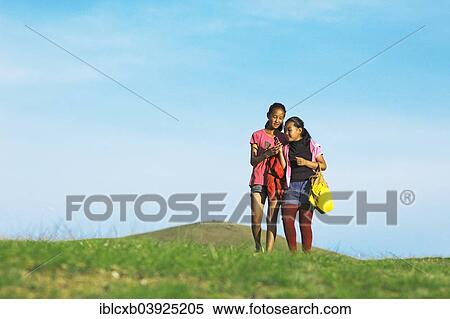 "Girls with their mobile phones in the hills of Khakhorin, Southern Steppe, Ovorkhangai Province, Mongolia, Asia" View Large Photo Image Stock Photography - "Girls with their mobile phones in the hills of Khakhorin, Southern Steppe, Ovorkhangai Province, Mongolia, Asia". Fotosearch