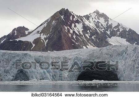 "Glacial portal, mouth of a meltwater stream under Samarinbreen Glacier, Tindegga Mountain at the rear, Samarinvagen, Hornsund, Spitsbergen Island, Svalbard Archipelago, Svalbard and Jan Mayen, Norway, Europe" View Large Photo Image Picture - "Glacial portal, mouth of a meltwater stream under Samarinbreen Glacier, Tindegga Mountain at the rear, Samarinvagen, Hornsund, Spitsbergen Island, Svalbard Archipelago, Svalbard and Jan Mayen, Norway, Europe". Fotosearch