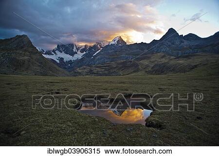 "Glaciated, snow-capped mountain peaks with a waterhole and a mountain pasture at dusk, Cordillera Huayhuash mountain range, Northern Peru, Peru, South America" View Large Photo Image Stock Photography - "Glaciated, snow-capped mountain peaks with a waterhole and a mountain pasture at dusk, Cordillera Huayhuash mountain range, Northern Peru, Peru, South America". Fotosearch