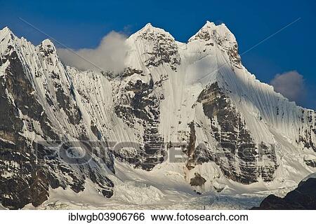 Stock Photograph - "Glaciated, snow-capped Mt Yerupaja, Cordillera, Huayhuash mountain range, Northern Peru, Peru, South America". Fotosearch
