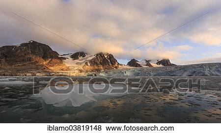 "Glacier landscape, iceberg at the front, mountains at sunset, Vasa-Stortinden, Svalbard, Spitsbergen, Norway, Europe" View Large Photo Image Stock Photo - "Glacier landscape, iceberg at the front, mountains at sunset, Vasa-Stortinden, Svalbard, Spitsbergen, Norway, Europe". Fotosearch