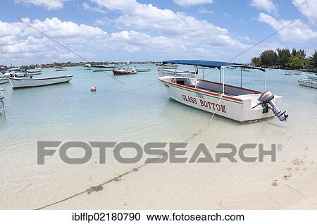 "Glass bottom tourist boat moored beside sandy beach, West Mauritius, Africa" View Large Photo Image Stock Image - "Glass bottom tourist boat moored beside sandy beach, West Mauritius, Africa". Fotosearch