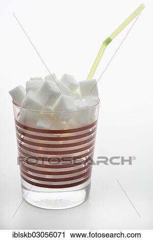 Glass filled with sugar cubes and a straw View Large Photo Image Stock Image - Glass filled with sugar cubes and a straw. Fotosearch