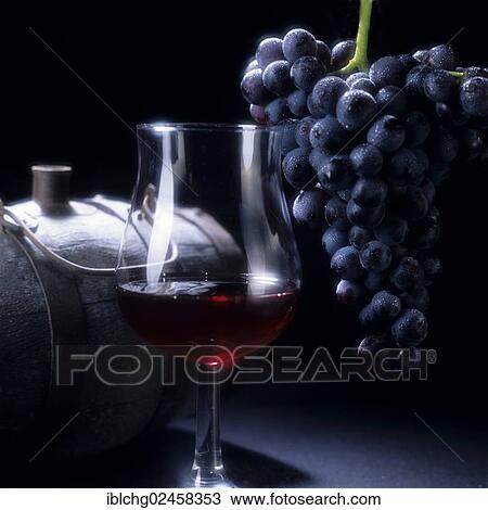 Stock Image - "Glass of red wine and grapes, Bordeaux, France, Europe". Fotosearch