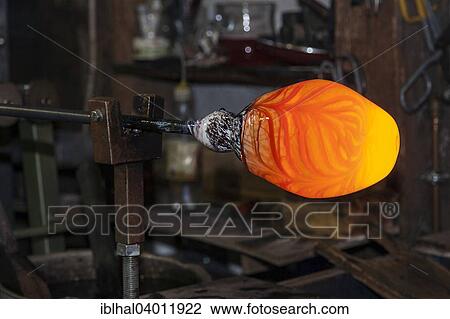Stock Image - "Glassblower, show glass blowing a glassware shop, at Bodenmais, Bavaria, Germany, Europe". Fotosearch