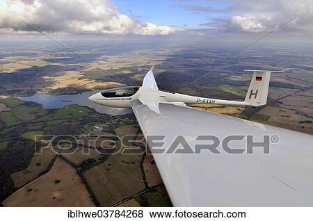 "Glider or sailplane, type ASH 26 E, updrafts stretching to the horizon, thermal energy roads, Wismar, Mecklenburg-Western Pomerania, Germany, Europe" View Large Photo Image Stock Photo - "Glider or sailplane, type ASH 26 E, updrafts stretching to the horizon, thermal energy roads, Wismar, Mecklenburg-Western Pomerania, Germany, Europe". Fotosearch