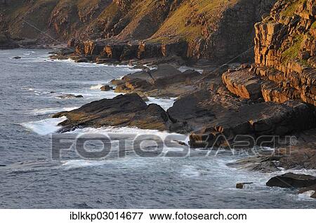 "Glowing rocks of the coastal cliffs of the Atlantic Ocean at sunset, Northern Highlands, Highlands, Sutherland County, Highland, Scotland, United Kingdom, Europe" View Large Photo Image Stock Photo - "Glowing rocks of the coastal cliffs of the Atlantic Ocean at sunset, Northern Highlands, Highlands, Sutherland County, Highland, Scotland, United Kingdom, Europe". Fotosearch
