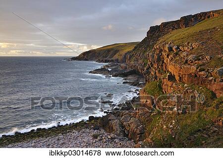 "Glowing rocks of the coastal cliffs of the Atlantic Ocean at sunset, Northern Highlands, Highlands, Sutherland County, Highland, Scotland, United Kingdom, Europe" View Large Photo Image Stock Photo - "Glowing rocks of the coastal cliffs of the Atlantic Ocean at sunset, Northern Highlands, Highlands, Sutherland County, Highland, Scotland, United Kingdom, Europe". Fotosearch