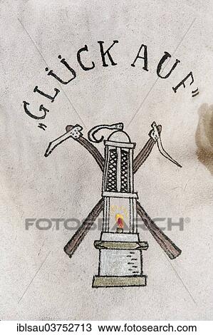 Stock Image - "Gluck Auf"""" or """"Good luck"""", drawing on leather, miner's lamp with hoes, North Rhine-Westphalia, Germany, Europe". Fotosearch