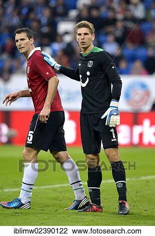 "Goalkeeper Ron-Robert Zieler, Hannover 96, patting Mario Eggimann, Hannover 96, on the back for a successful defensive action, Hoffenheim Wirsol Rhein-Neckar-Arena, Sinsheim, Baden-Wuerttemberg, Germany, Europe" View Large Photo Image Stock Image - "Goalkeeper Ron-Robert Zieler, Hannover 96, patting Mario Eggimann, Hannover 96, on the back for a successful defensive action, Hoffenheim Wirsol Rhein-Neckar-Arena, Sinsheim, Baden-Wuerttemberg, Germany, Europe". Fotosearch
