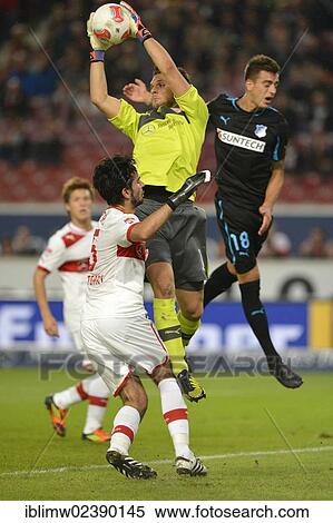Stock Photography - "Goalkeeper Sven ULREICH, VfB Stuttgart, catching the ball in front of Joselu, TSG 1899 Hoffenheim, right, at the bottom Serdar TASCI, VfB Stuttgart, Mercedes-Benz Arena, Stuttgart, Baden-Wuerttemberg, Germany, Europe". Fotosearch