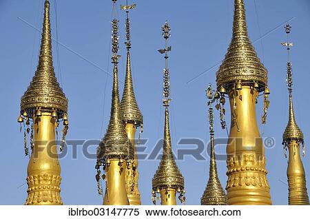 "Gold-coloured stupas with golden hti, umbrella or top ornaments, Nyaung Shwe, Inle-See, Shan State, Myanmar, Burma, Asia" View Large Photo Image Stock Photography - "Gold-coloured stupas with golden hti, umbrella or top ornaments, Nyaung Shwe, Inle-See, Shan State, Myanmar, Burma, Asia". Fotosearch